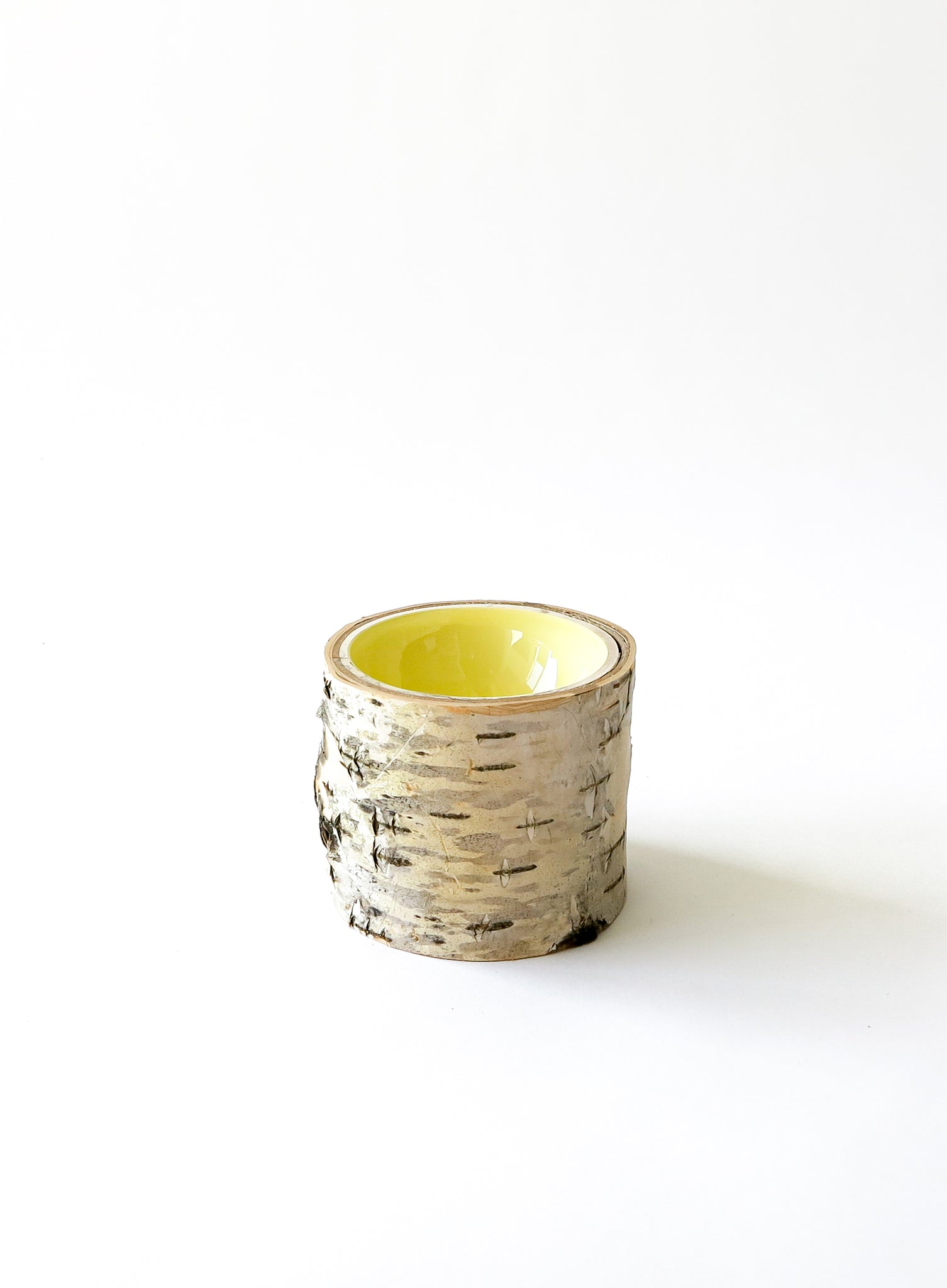 Size 3 Log Bowl - small wooden bowl with papery birch bark, glossy interior is a butter yellow colour.