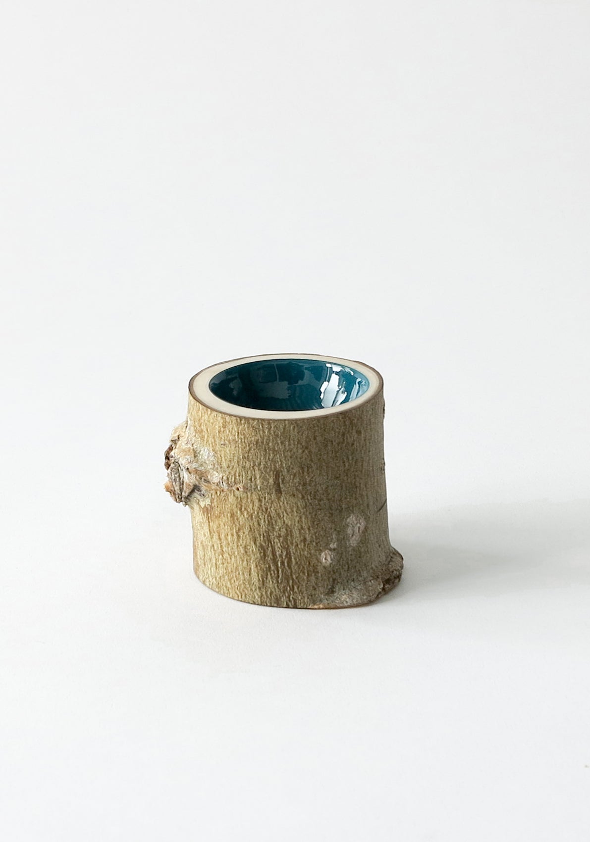 Extra Small wooden bowl with rough bark, glossy interior is a dark teal peacock colour.