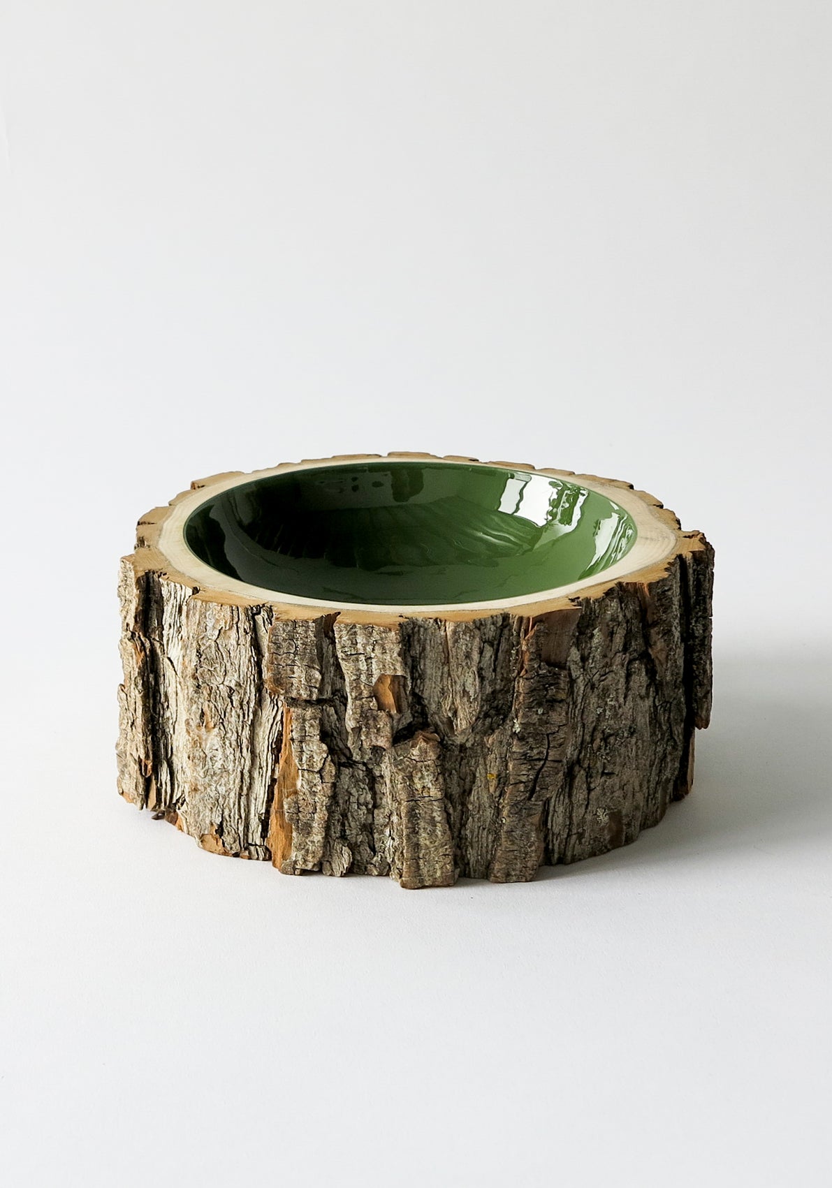 Size 7 Log Bowl - Medium to large wooden bowl with rough bark, glossy interior is a rich olive colour.