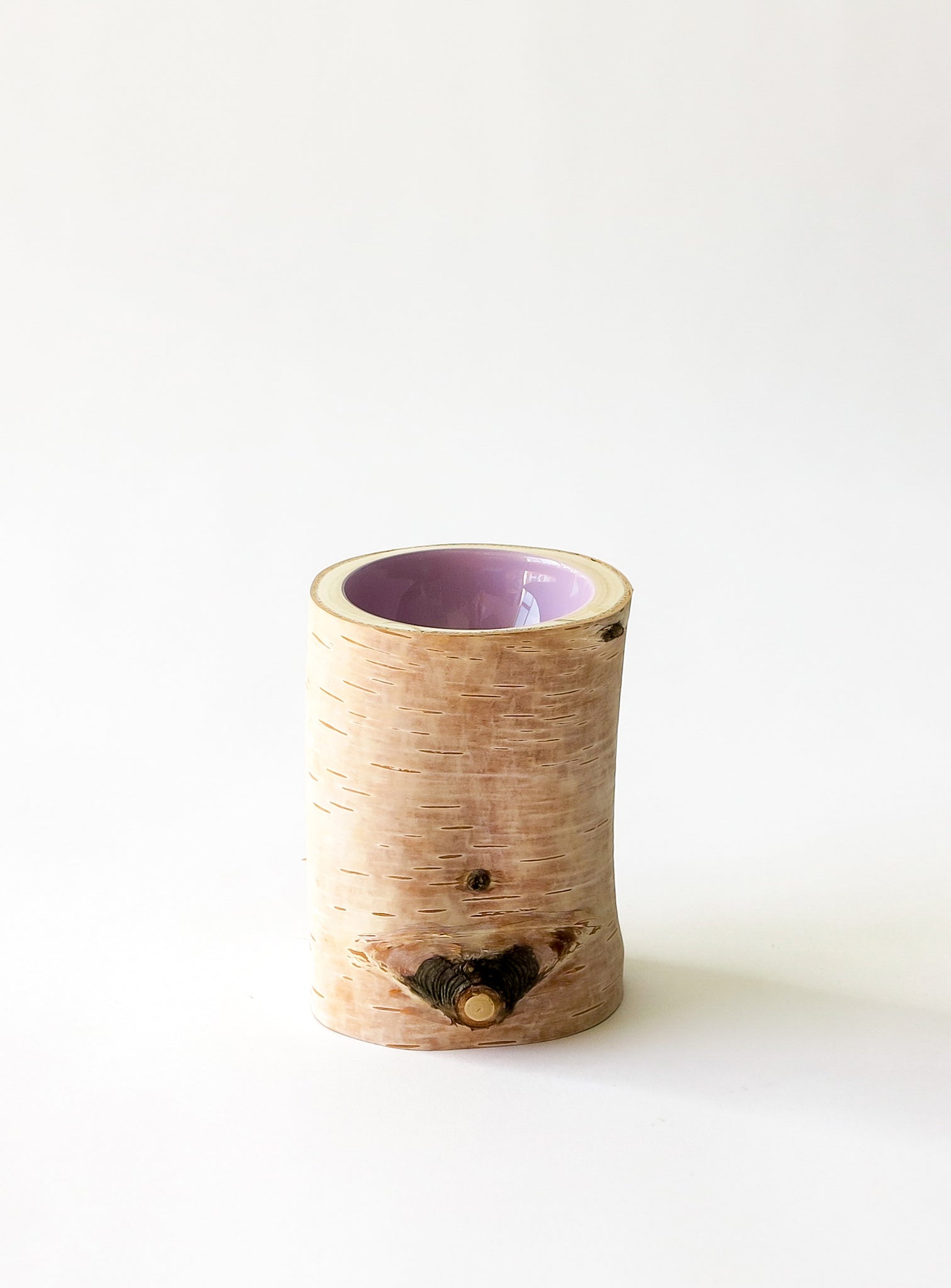 other side of Size 2 Log Bowl - extra small wooden bowl with papery birch bark, glossy interior is a light lilac purple colour.