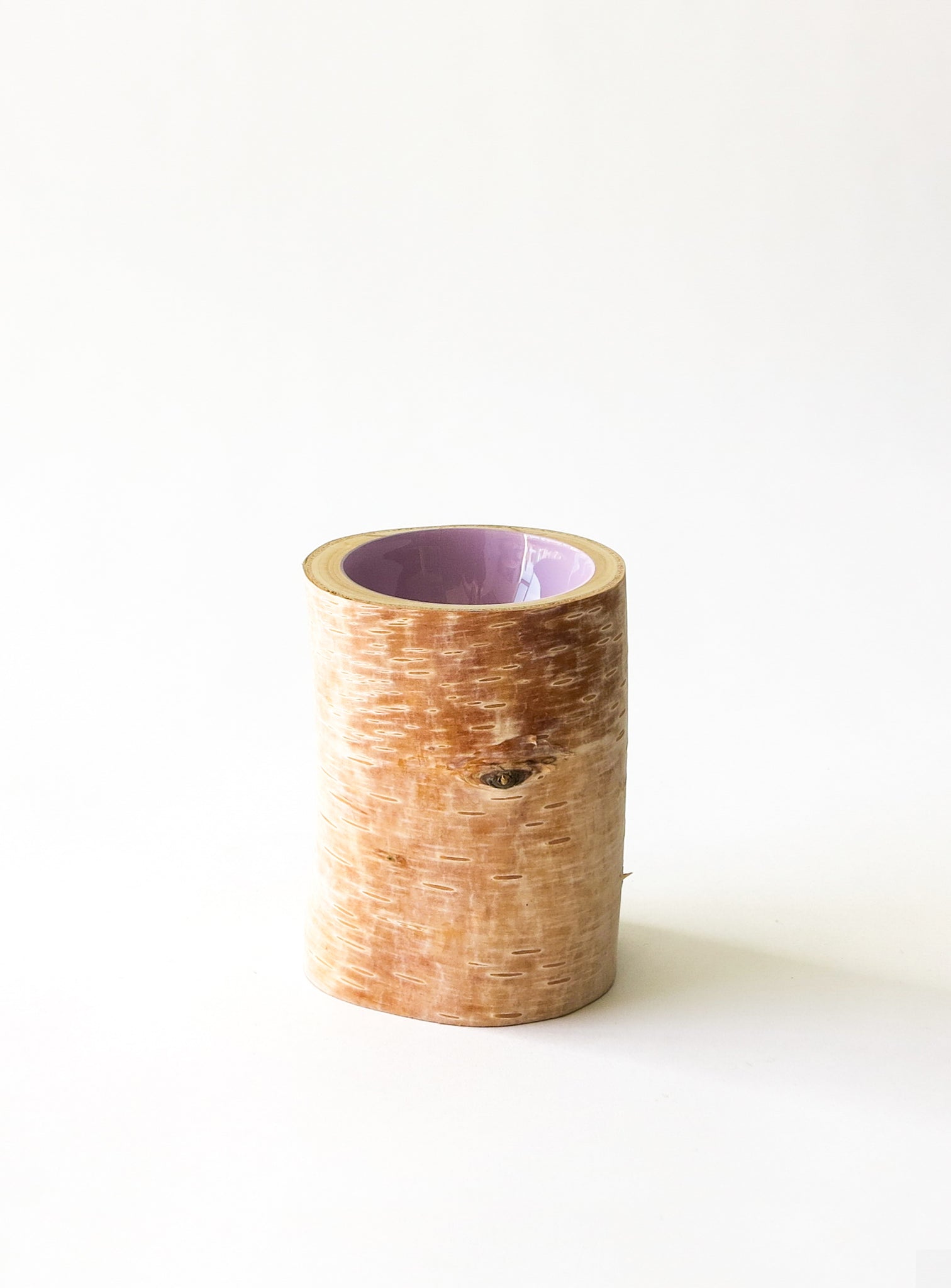 Size 2 Log Bowl - extra small wooden bowl with papery birch bark, glossy interior is a light lilac purple colour.